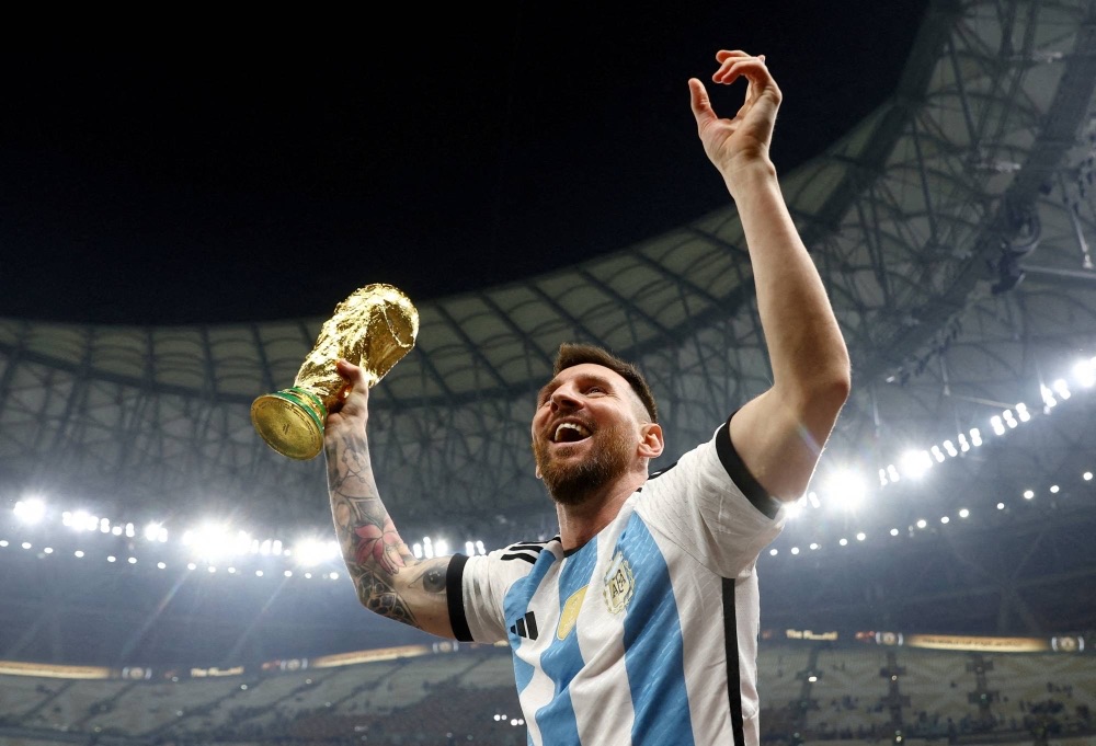 Argentina's Lionel Messi celebrates winning the FIFA World Cup in Qatar in December 2022. | REUTERS 2